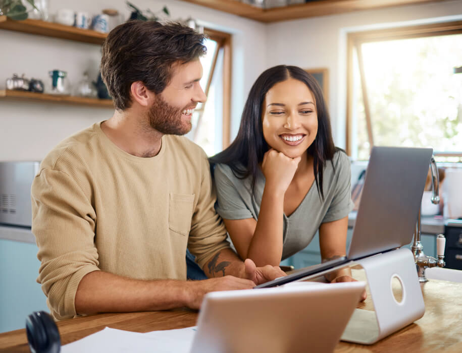 Young couple looking at a laptop