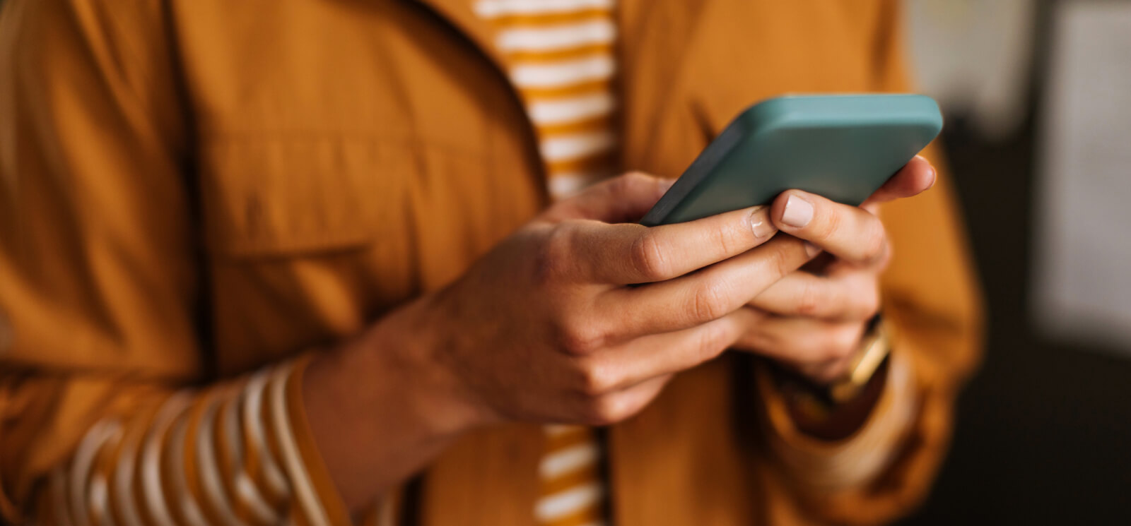 Close up of hands holding a smartphone